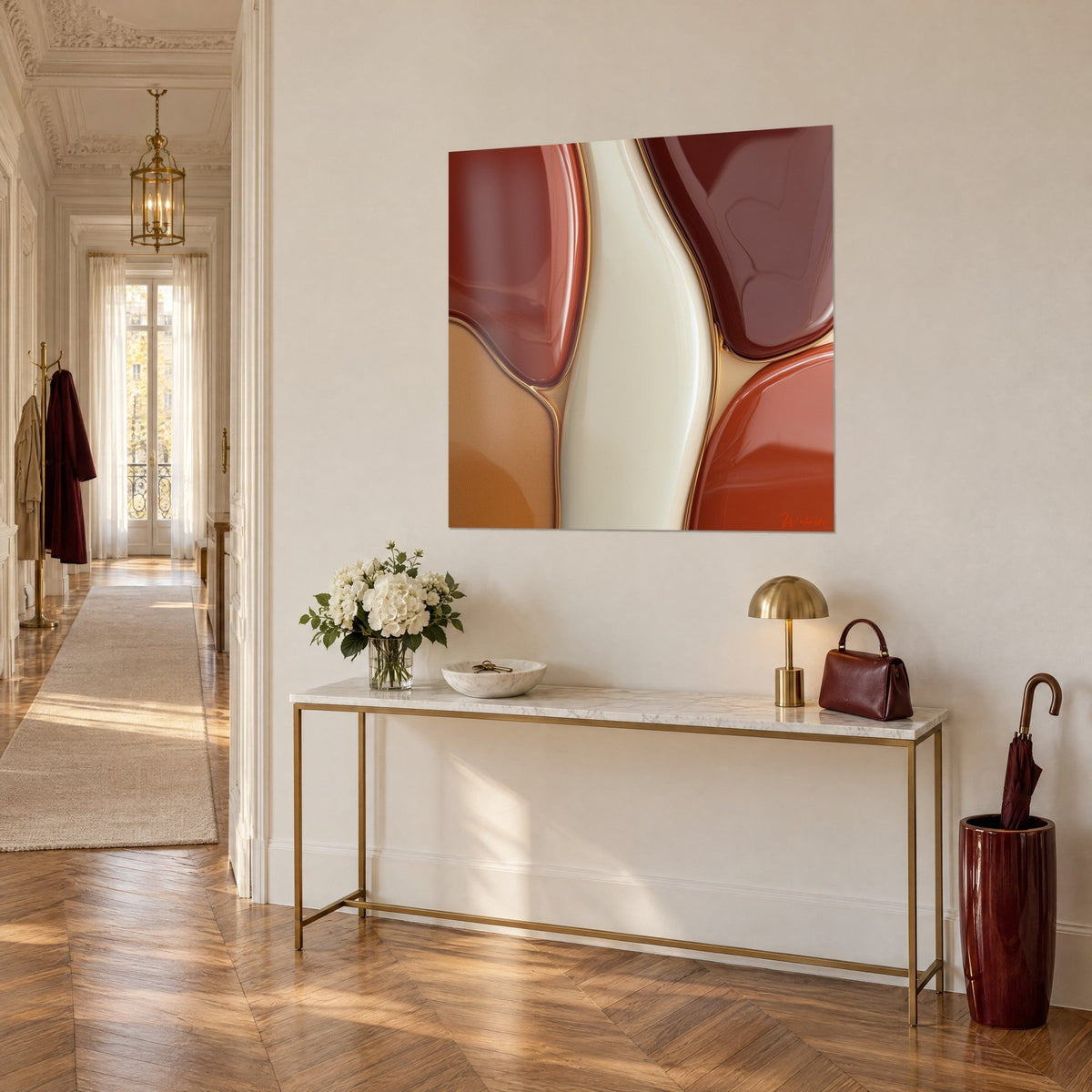 Wall art with a vitrified membrane of rust and cream pebbles, shiny gold edging, three-quarter view of a hallway console
