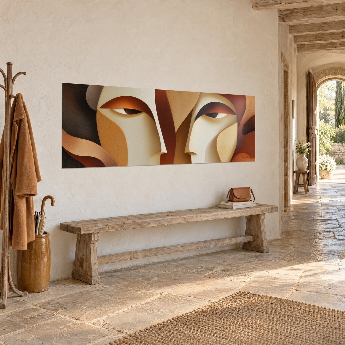 Wall art two half-closed gazes in cream and rust washes, deep black on the left, hung in a stone entryway