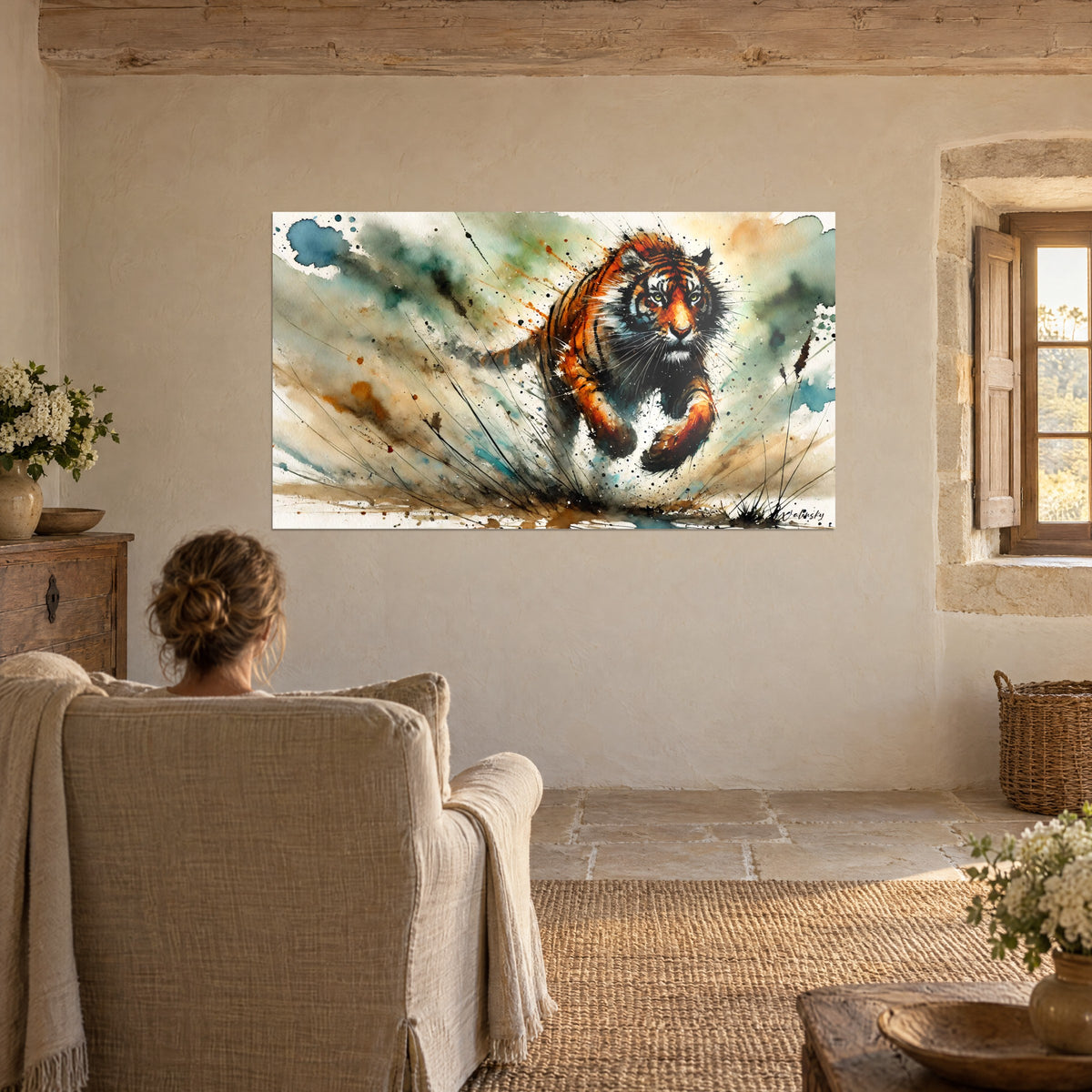 Wall art of a tiger charging head-on at a gallop, sepia and sea-green splashes, facing a linen armchair near a window