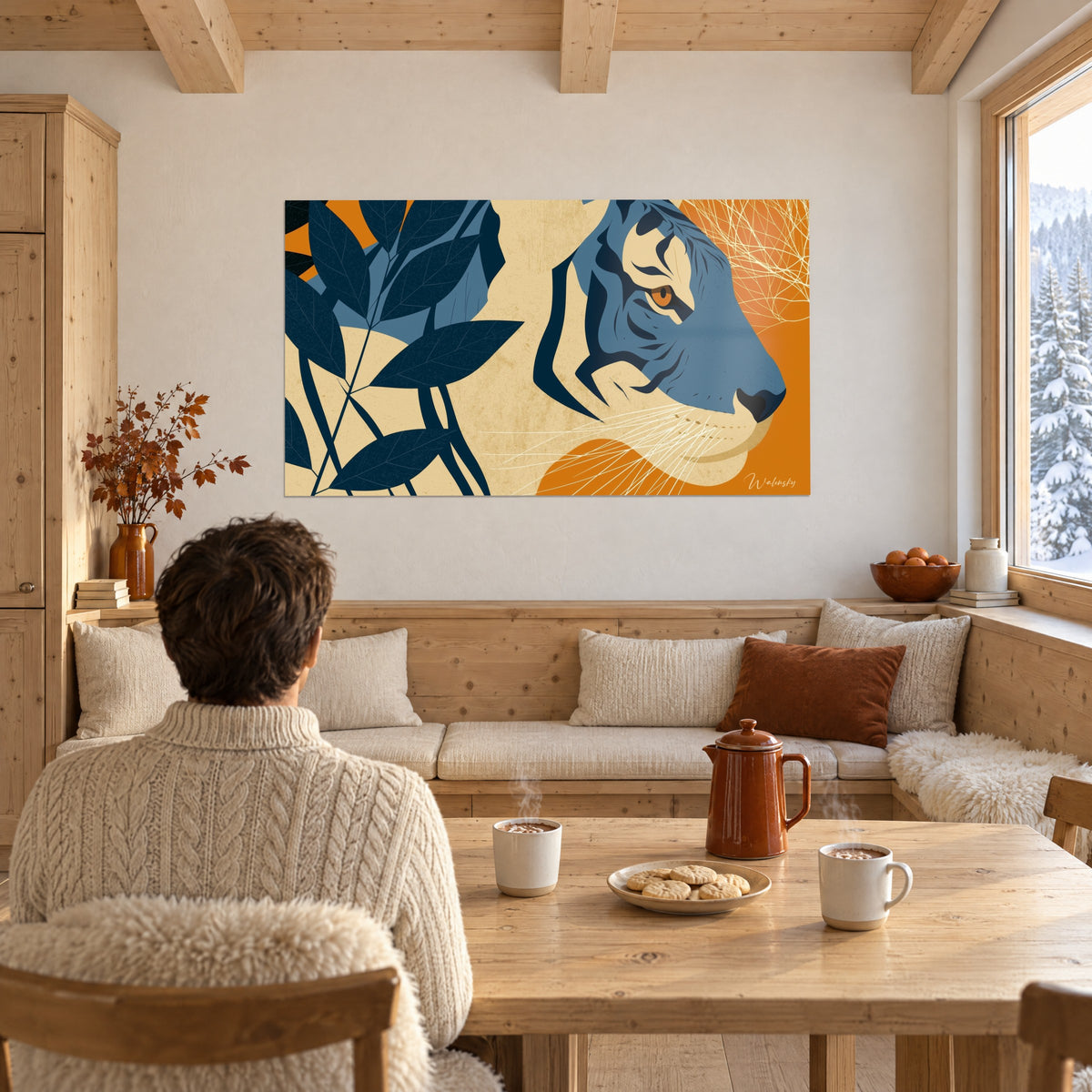 Wall art of a big cat in petrol blue with an amber gaze, midnight-blue cut-out leaves on grainy beige, facing a chalet wooden table
