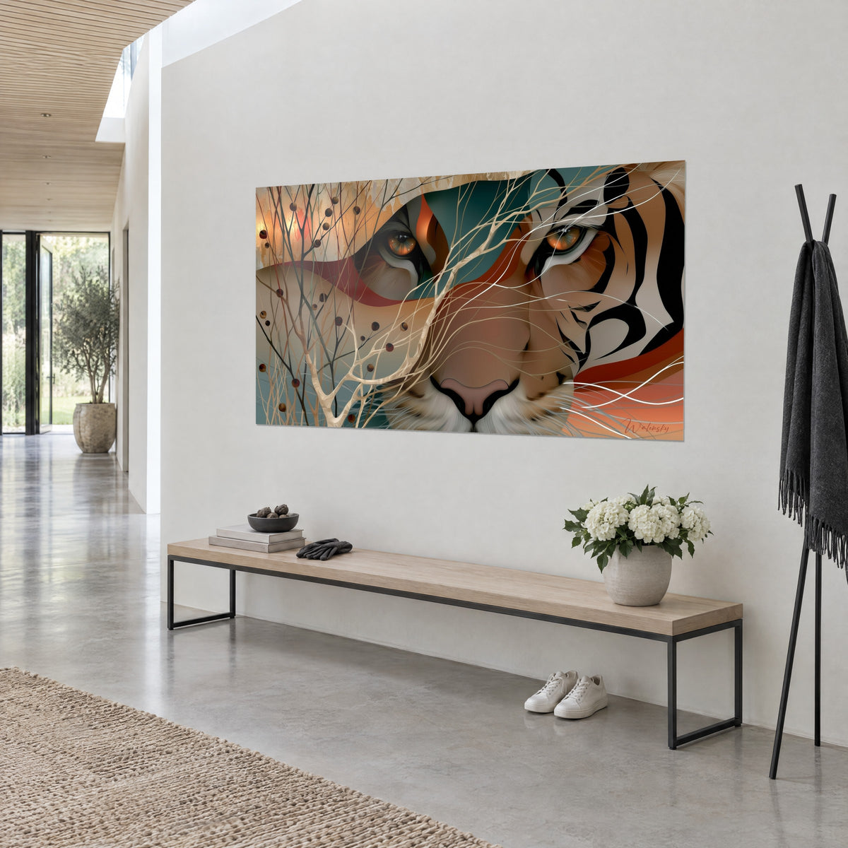 Wall art striped feline with a crouching gaze, black and burnt orange, bare branches and dark berries, white wall of a light hallway