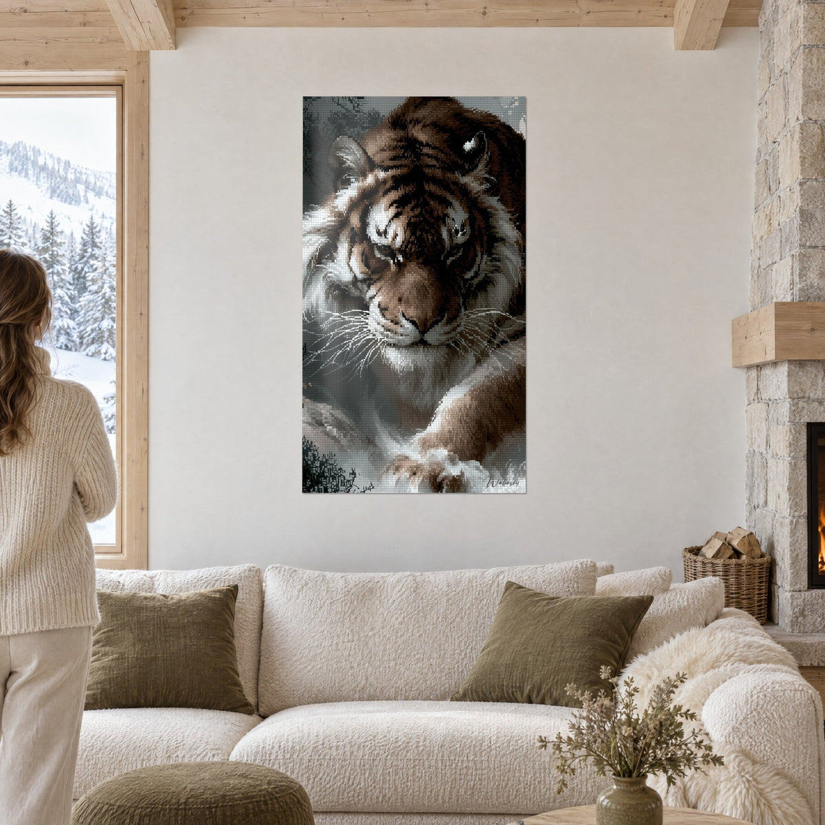 Wall art of a striped feline in a brown and anthracite mosaic, head lowered, above a sofa in a bright living room