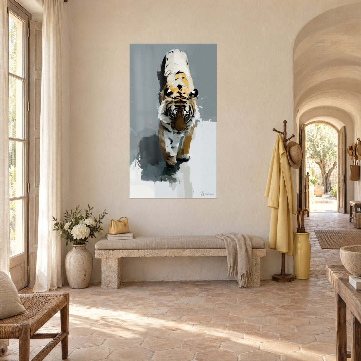 Wall art of a large face-on feline with black stripes, orange and ivory coat on slate grey, in a vaulted corridor of pale stone
