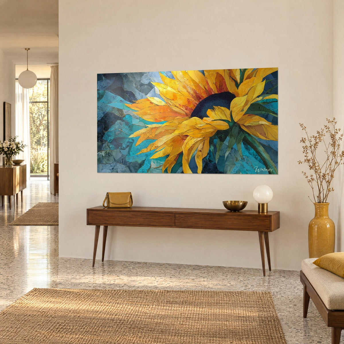 Wall art solar flower with a midnight blue center, golden yellow and orange petals bursting outward, hung above a wooden console