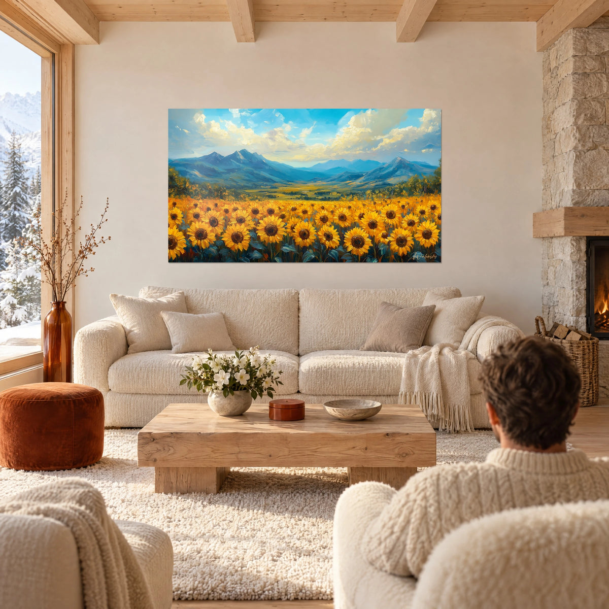 Tableau champ de tournesols jaune d'or sous les cimes bleues, ciel moutonné, couple de dos au-dessus d'un canapé dans un salon lumineux