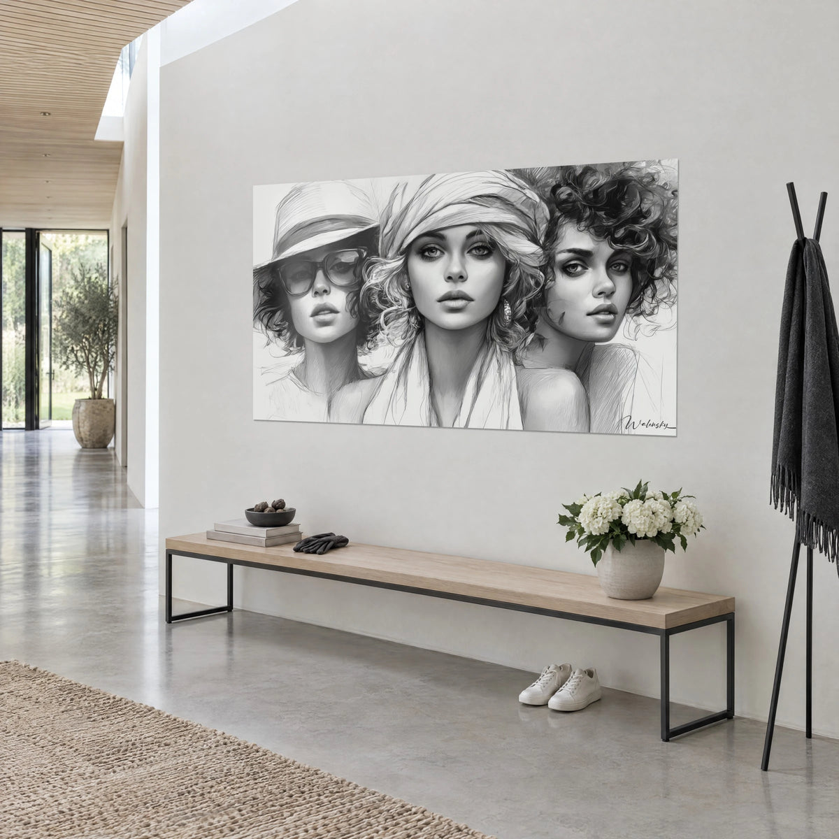 Cuadro tríptico de retratos dibujados, pañuelo claro anudado y rizos castaños, gris carbón sobre fondo blanco, pared de un salón minimalista