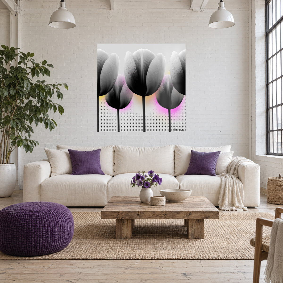 Wall art of grey and black tulips with satin petals, pink and yellow splashes, dot pattern, hung above a sofa in a bright living room