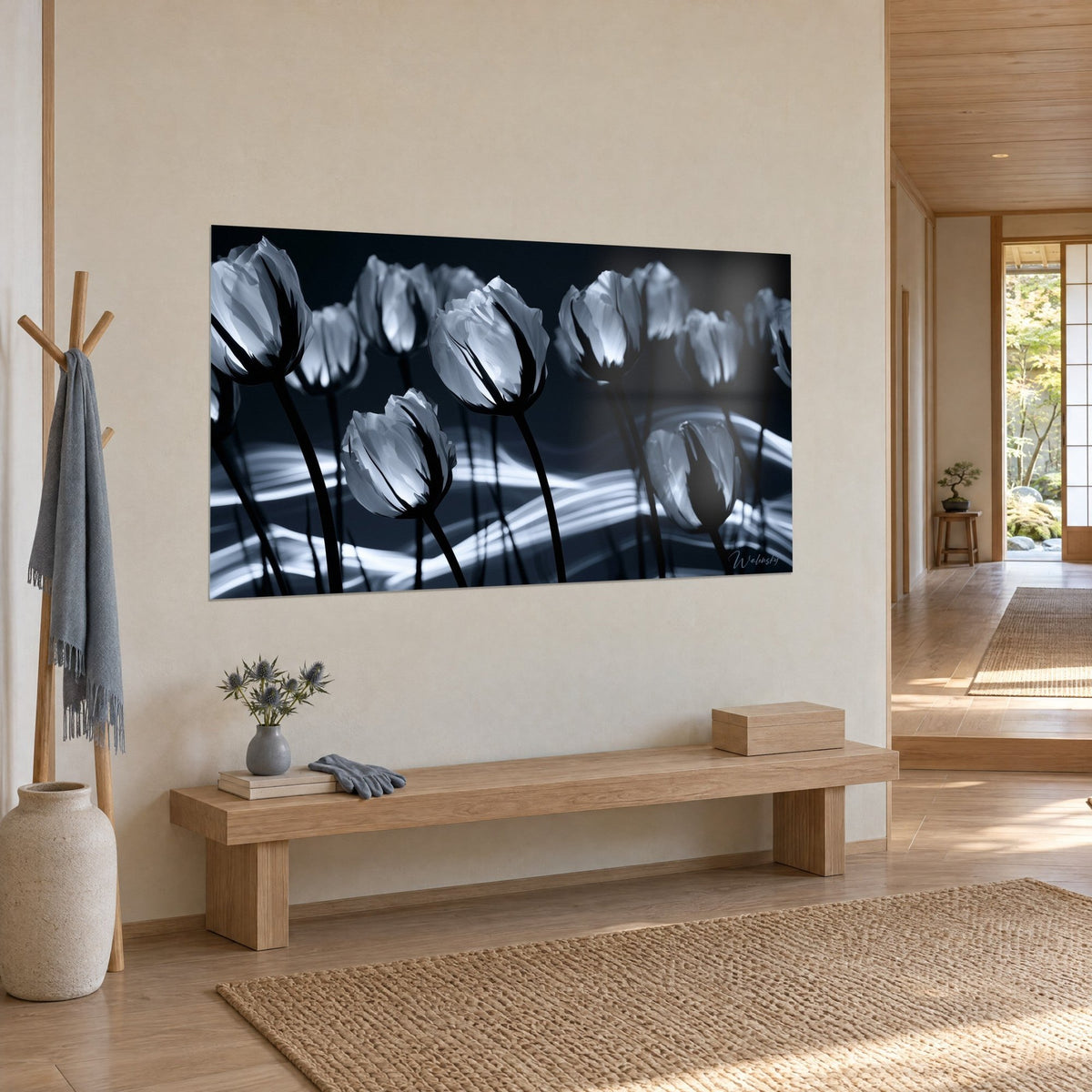 Wall art bouquet of mother-of-pearl blossoms on black stems, white waves of light on navy blue, beige wall of a Japandi hallway