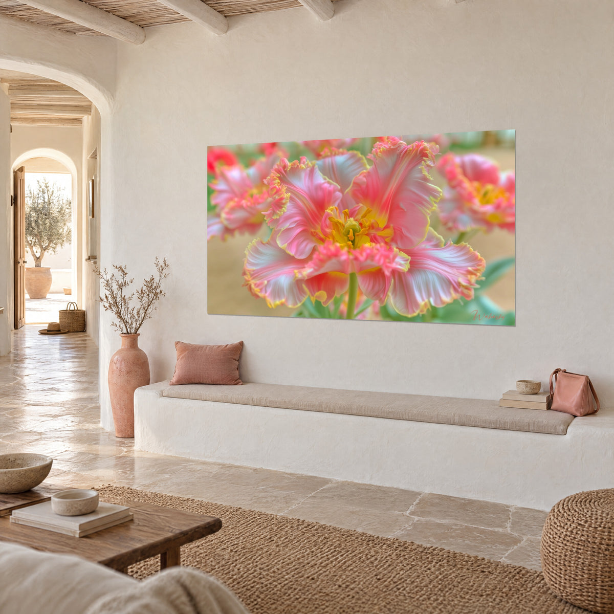 Wall art pale pink ruffled flower with yellow edging, golden stamens, on a lime-washed wall of a Mediterranean house