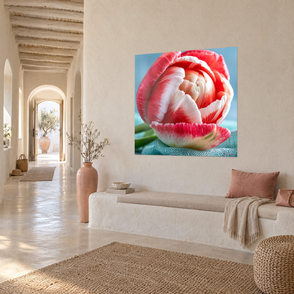 Wall art flower with carmine and ivory striped petals, turquoise linen canvas, cream wall, bench and vaulted hallway in three-quarter view
