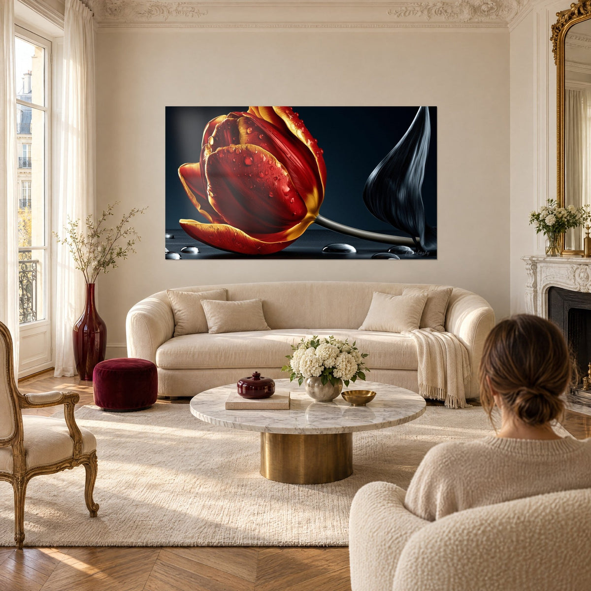 Wall art red and gold tulip beaded with dew drops on a midnight blue background, woman seen from behind, above a sofa in a bright living room