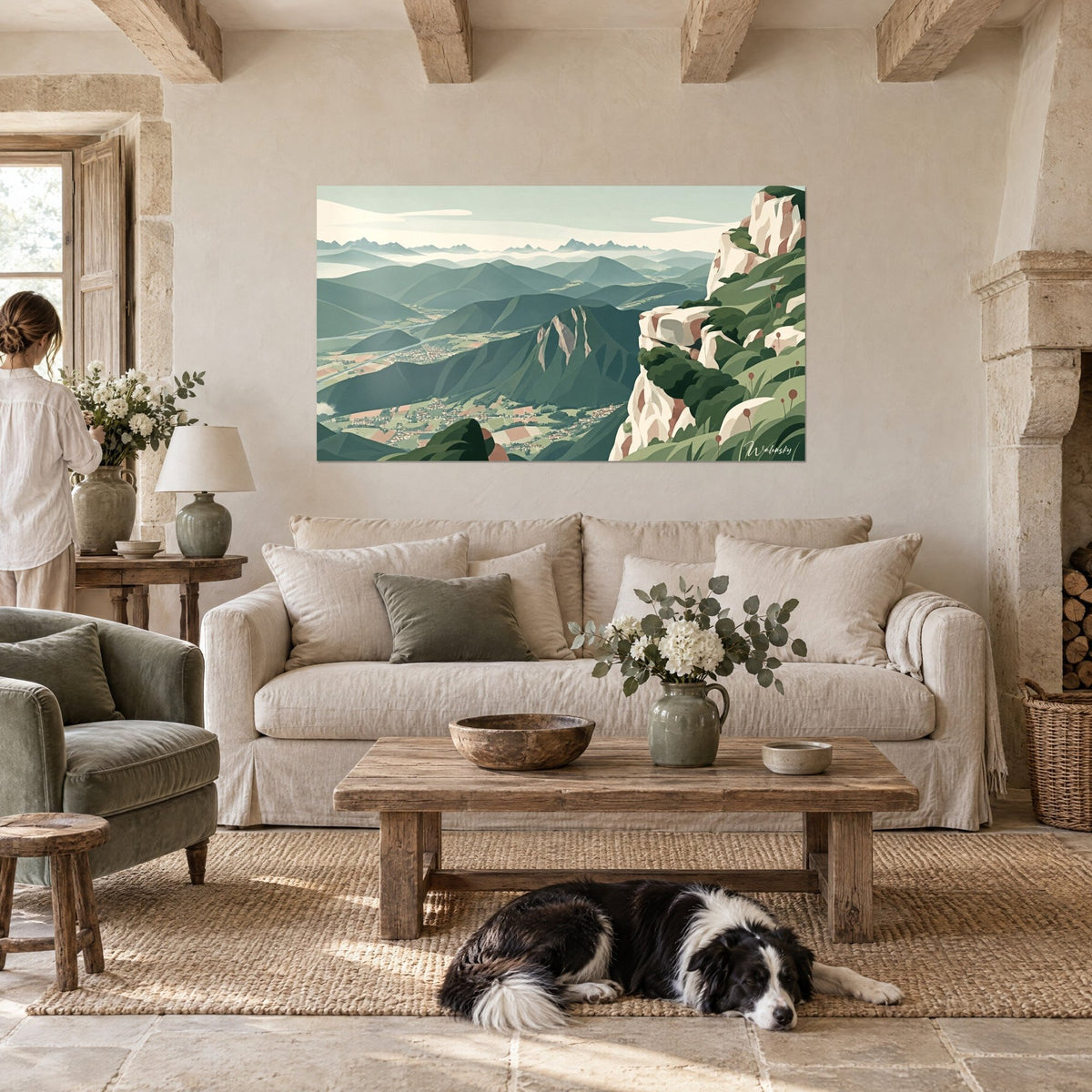 Tableau paysage alpin vert sauge, falaise crème et vallée brumeuse, collie couché, au-dessus d'un canapé dans un salon lumineux