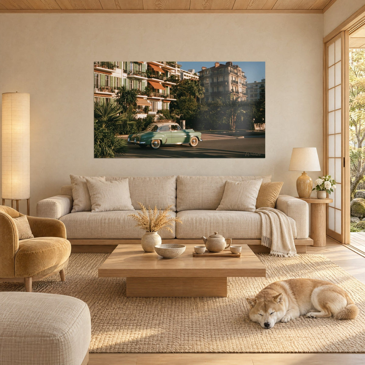 Wall art of a vintage green almond convertible driving past palm trees, ochre facade and green shutters, Shiba, above a sofa in a bright living room