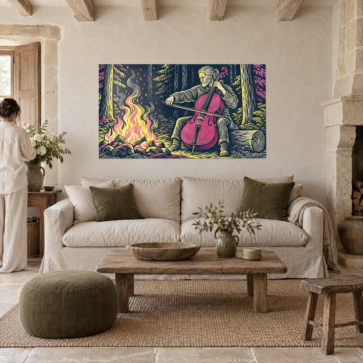 Tableau violoncelliste barbu face aux flammes roses et jaunes, fond bleu nuit, au-dessus d'un canapé dans un salon lumineux