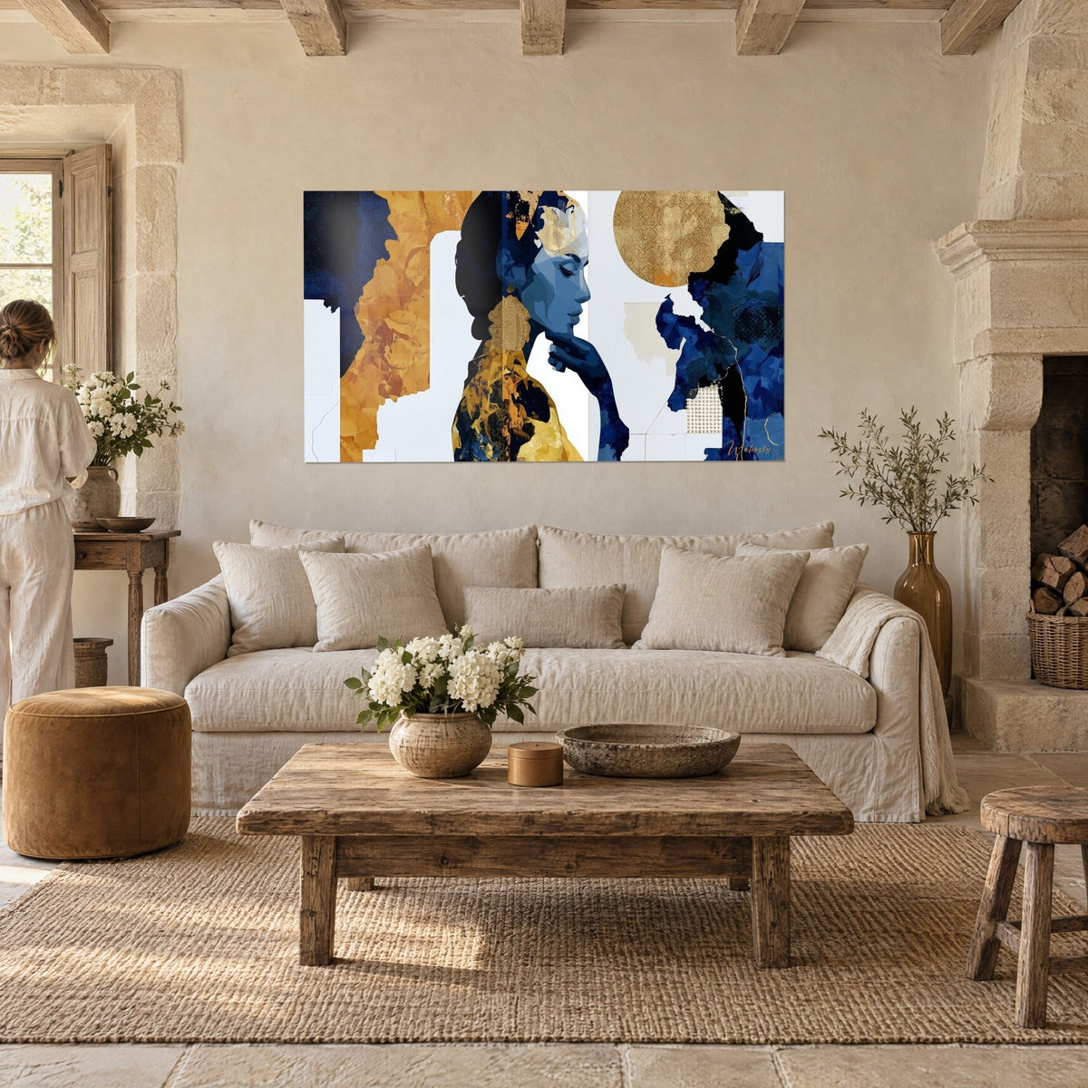 Wall art navy blue and gold collage female profile, ochre moon in the background, two people seen from behind, above a sofa in a bright living room