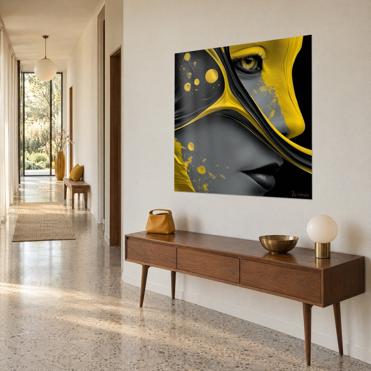 Wall art abstract portrait with black and lemon yellow drips, dark lips and a clear gaze, three-quarter view at the end of a hallway
