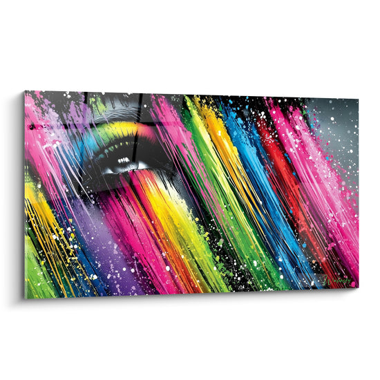 Œil noir et blanc cerné de coulures roses, vertes et bleues sur tableau visage abstrait vibrant