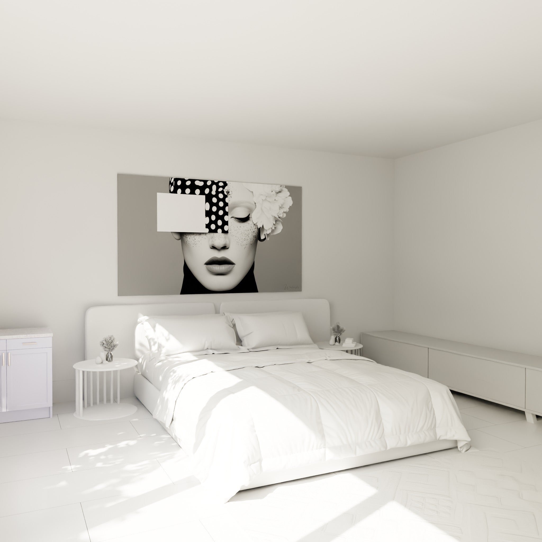 Portrait graphique noir et blanc à fleur blanche accroché au-dessus d'un lit dans une chambre claire