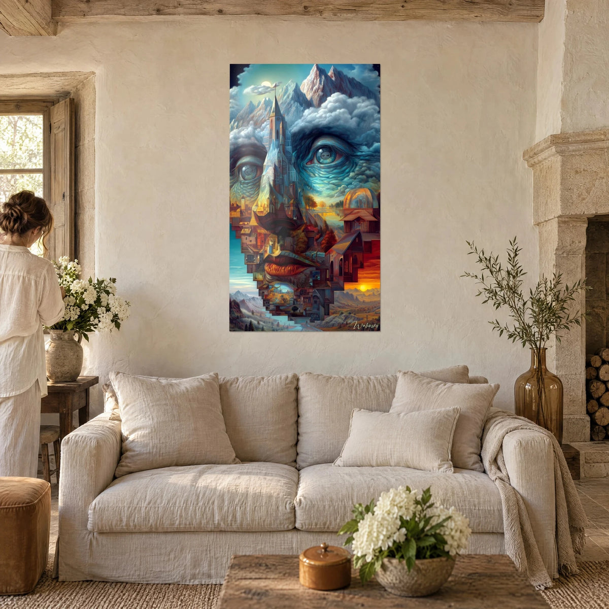 Gemälde Steingesicht mit blaugrünen Augen, Kirchturm und ockerfarbene Dächer als Nase, über einem Sofa in einem hellen Wohnzimmer