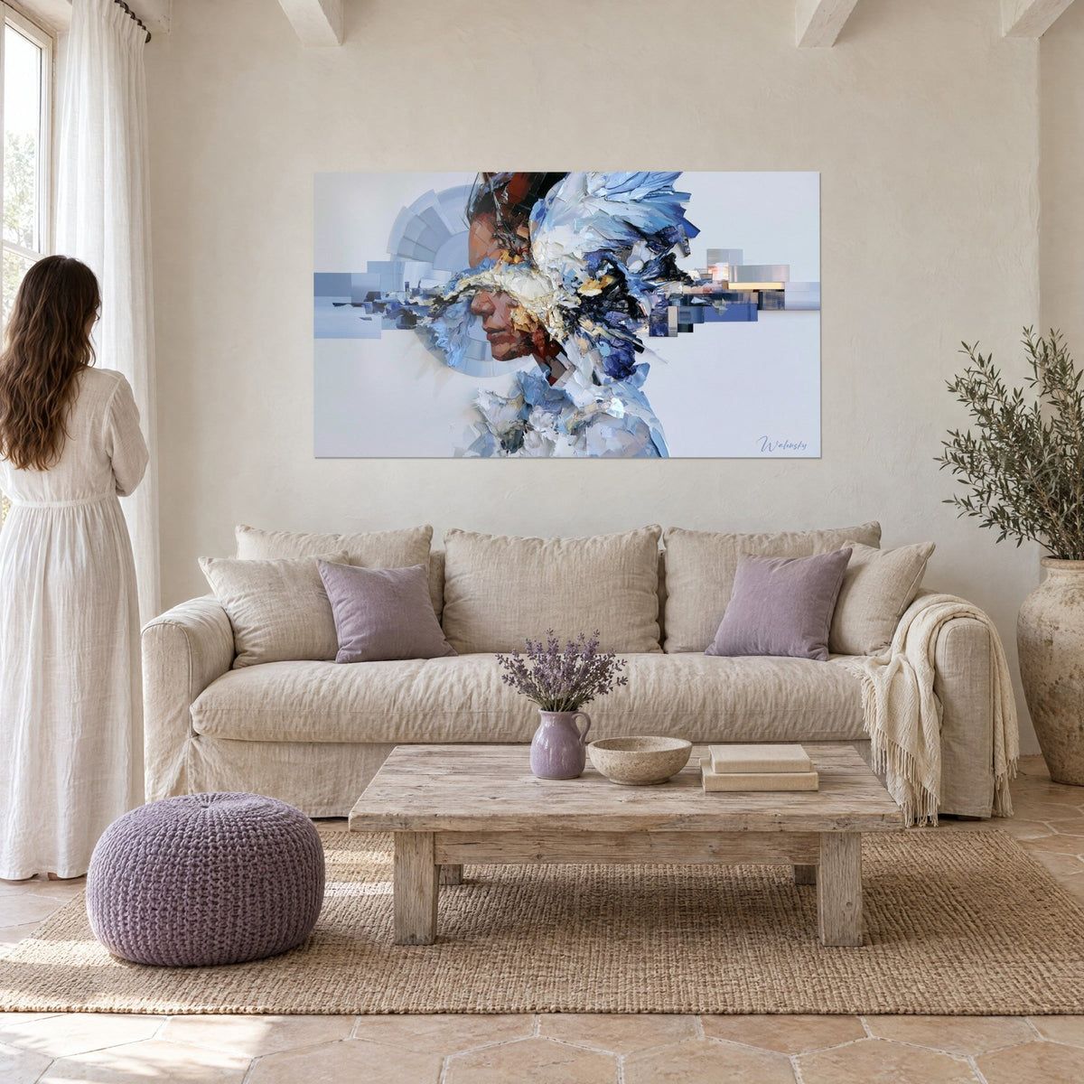 Wall art female profile shattered into cobalt blue and ivory white fragments, thick paint strokes, above a sofa in a bright living room
