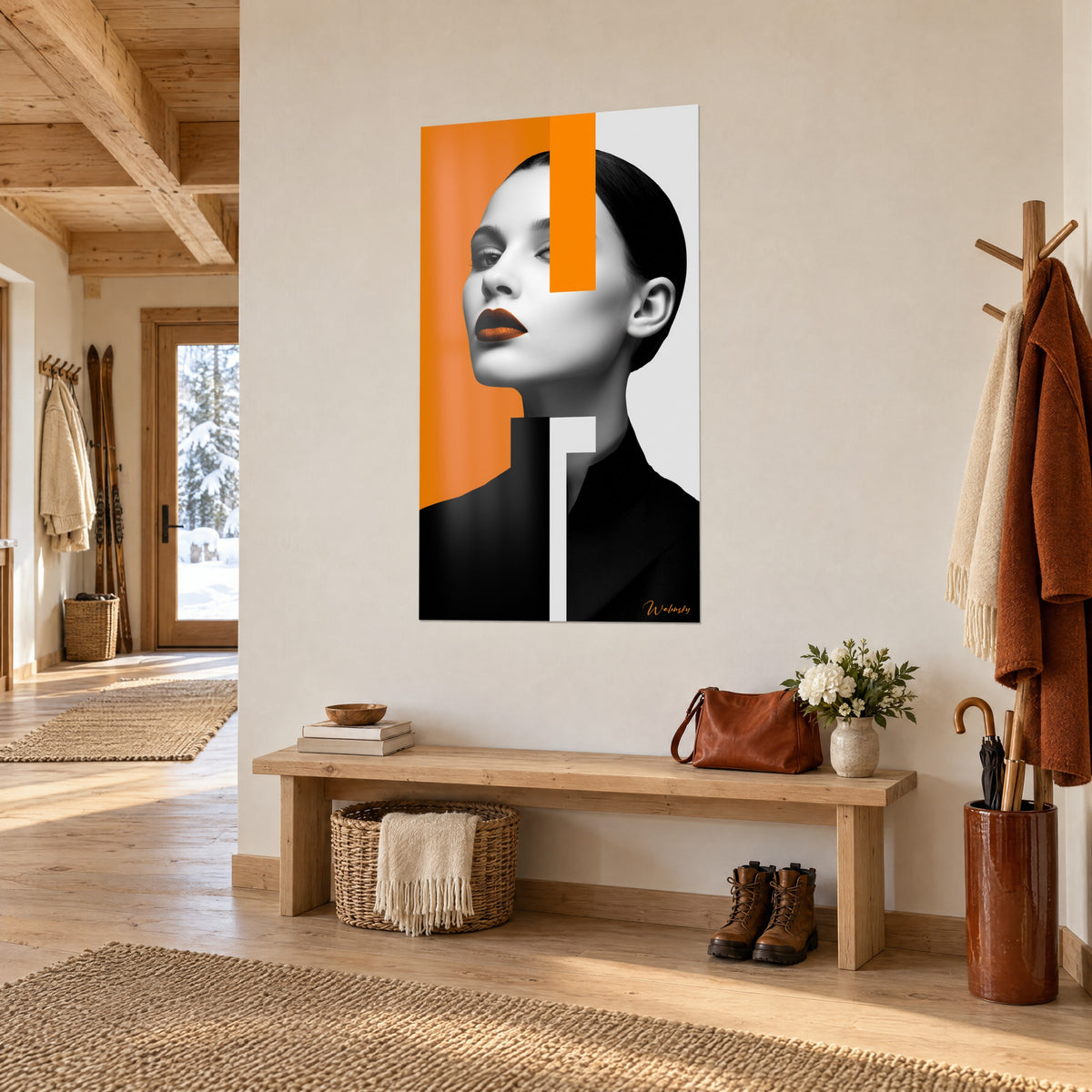 Tableau profil sculptural au chignon noir, rectangles orange et gris perle, accroché dans une entrée en bois clair de chalet