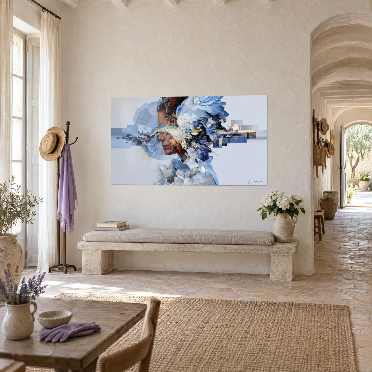 Wall art fractured portrait with azure and cream shards, metal strips on the right, hung above a stone bench in a Provençal farmhouse