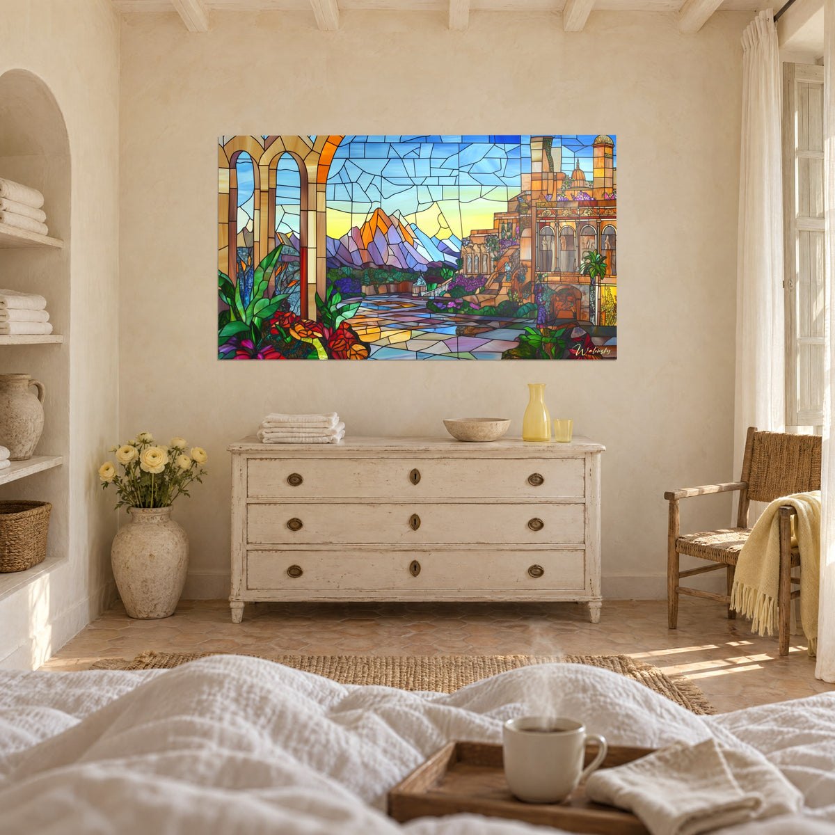 Wall art mountain panorama in pale stained glass: mauve peaks, yellow and blue sky, multicoloured paving, above a bed in a light bedroom