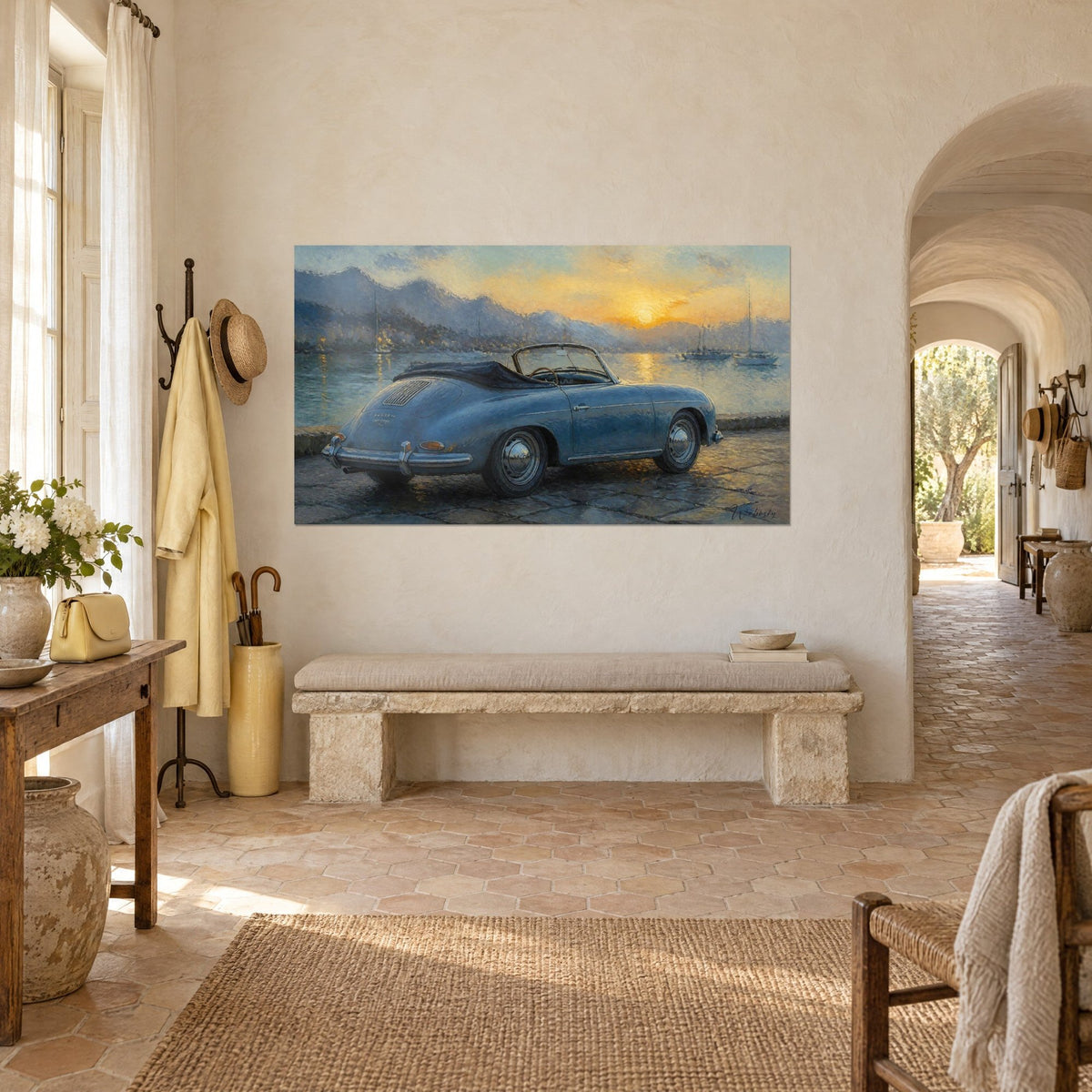Wall art of a vintage roadster with rounded blue-grey fenders, black soft top folded down, golden sky, in the entrance of a Provençal farmhouse