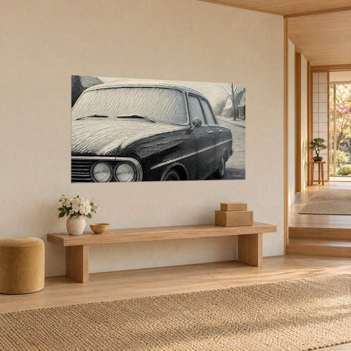 Wall art of a black vintage car draped in creamy snow, round silver headlights, street lined with houses, Japandi wooden bench