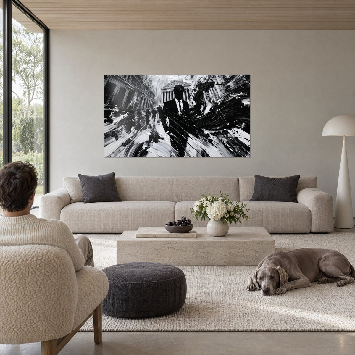 Wall art of a faceless business silhouette, deep black and chalky white, palette-knife strokes, above a sofa in a bright living room