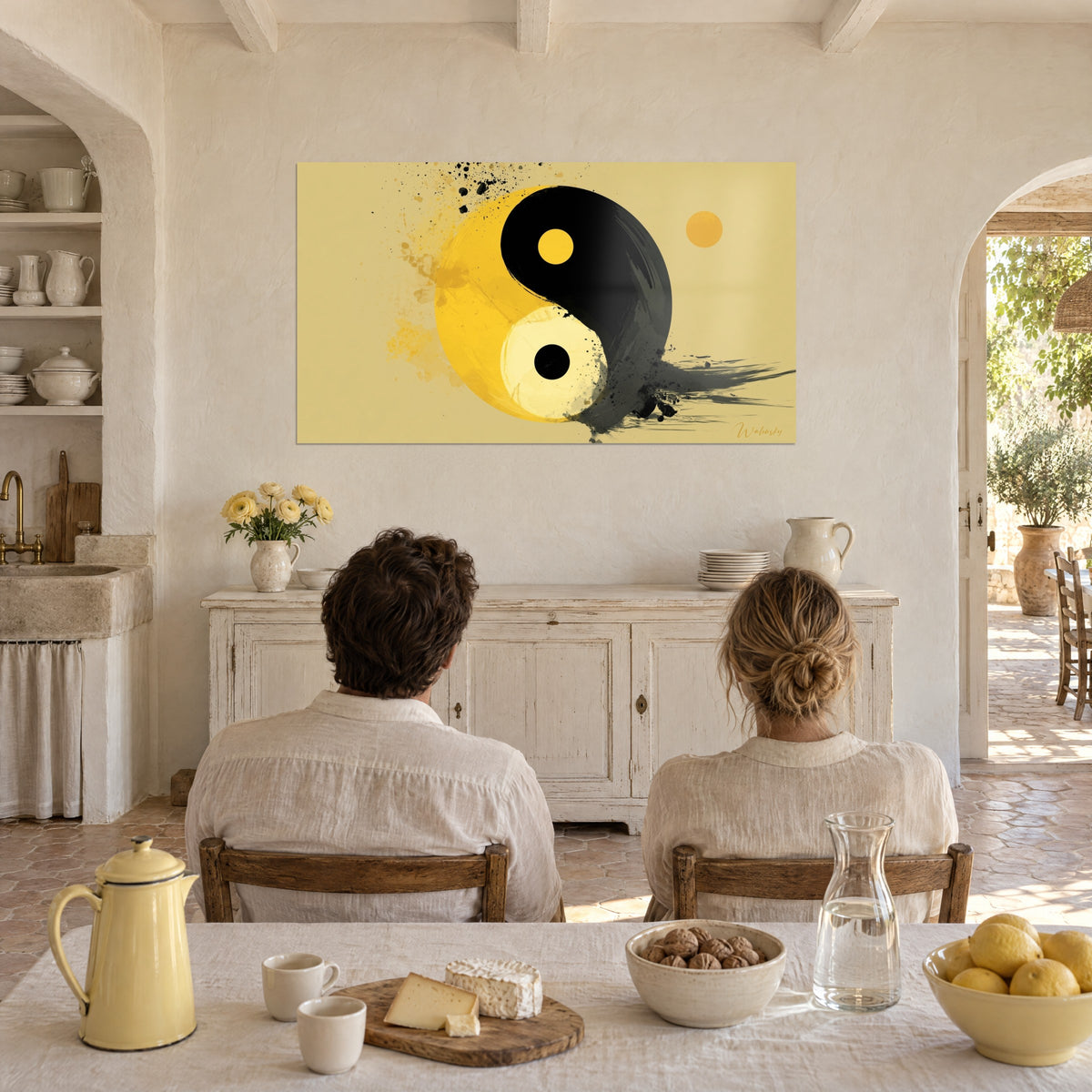 Wall art balance of opposites in vivid yellow and deep black, small ochre disc on the right, in front of a couple seen from behind in a farmhouse