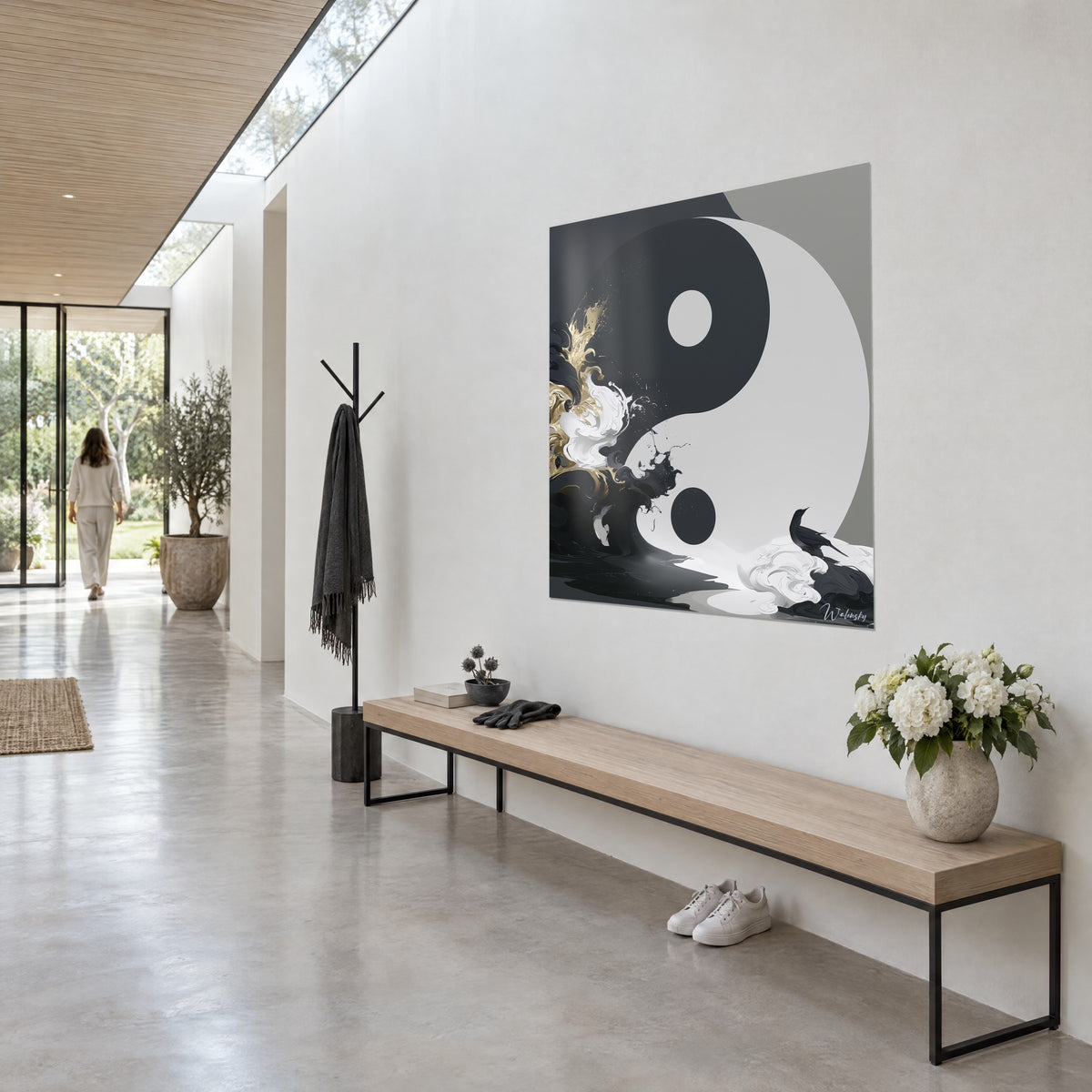 Wall art black and white ink circle, golden foam on the left, perched bird, three-quarter view on a light hallway wall