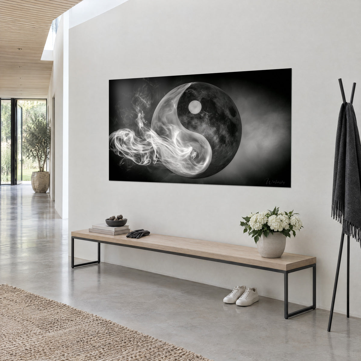 Wall art Tao symbol half moon, half smoke: charcoal sphere dotted with craters and silvery wisps, perspective view, white wall