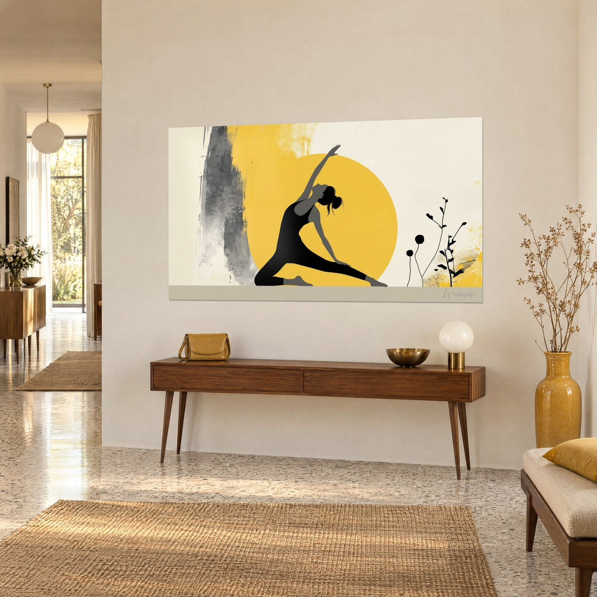Wall art black cut-out yoga posture against a yellow sun, cream background, fine twigs, above a wooden console table