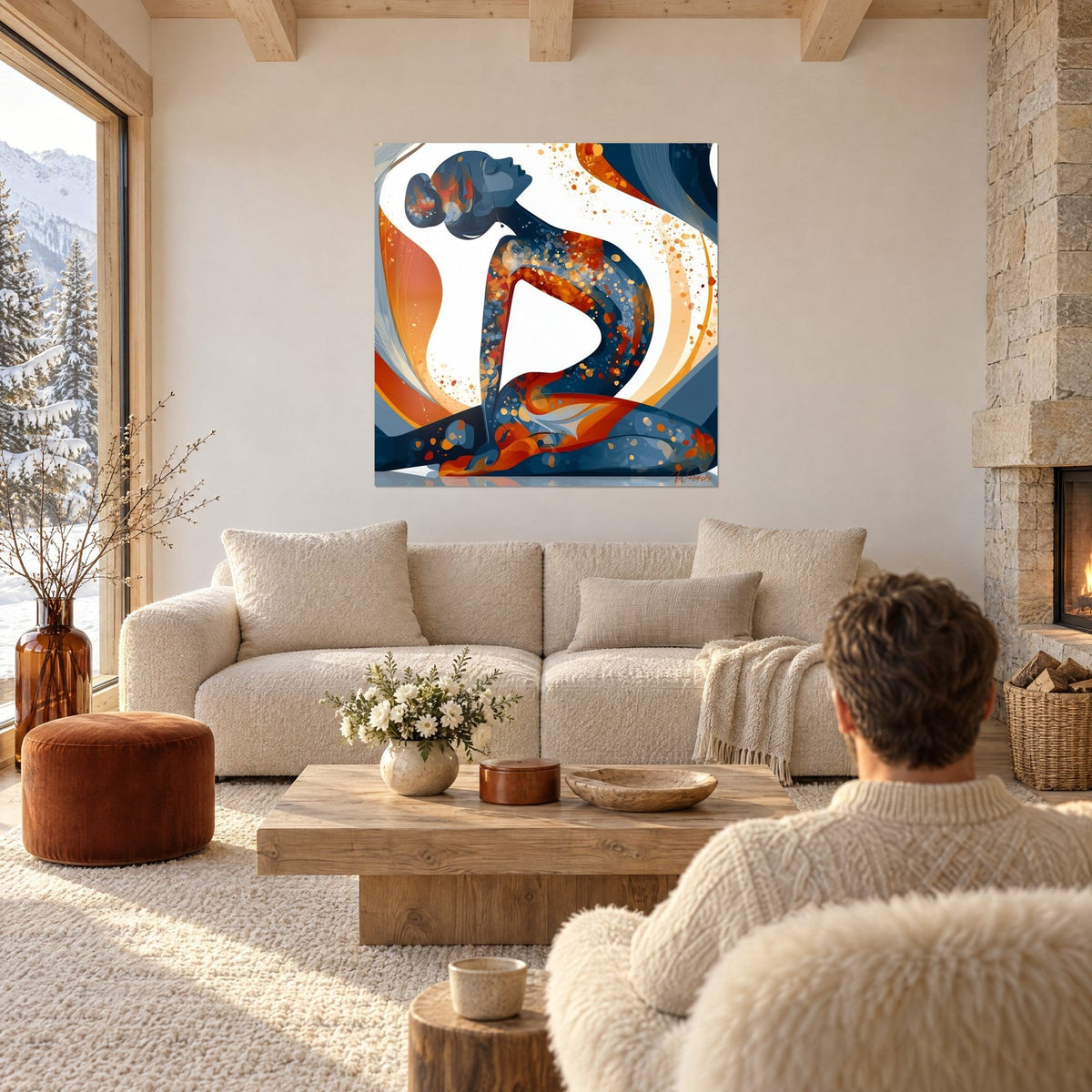 Quadro sagoma di yoga inarcata, schizzi arancio e blu notte su fondo bianco, sopra un divano in un soggiorno luminoso