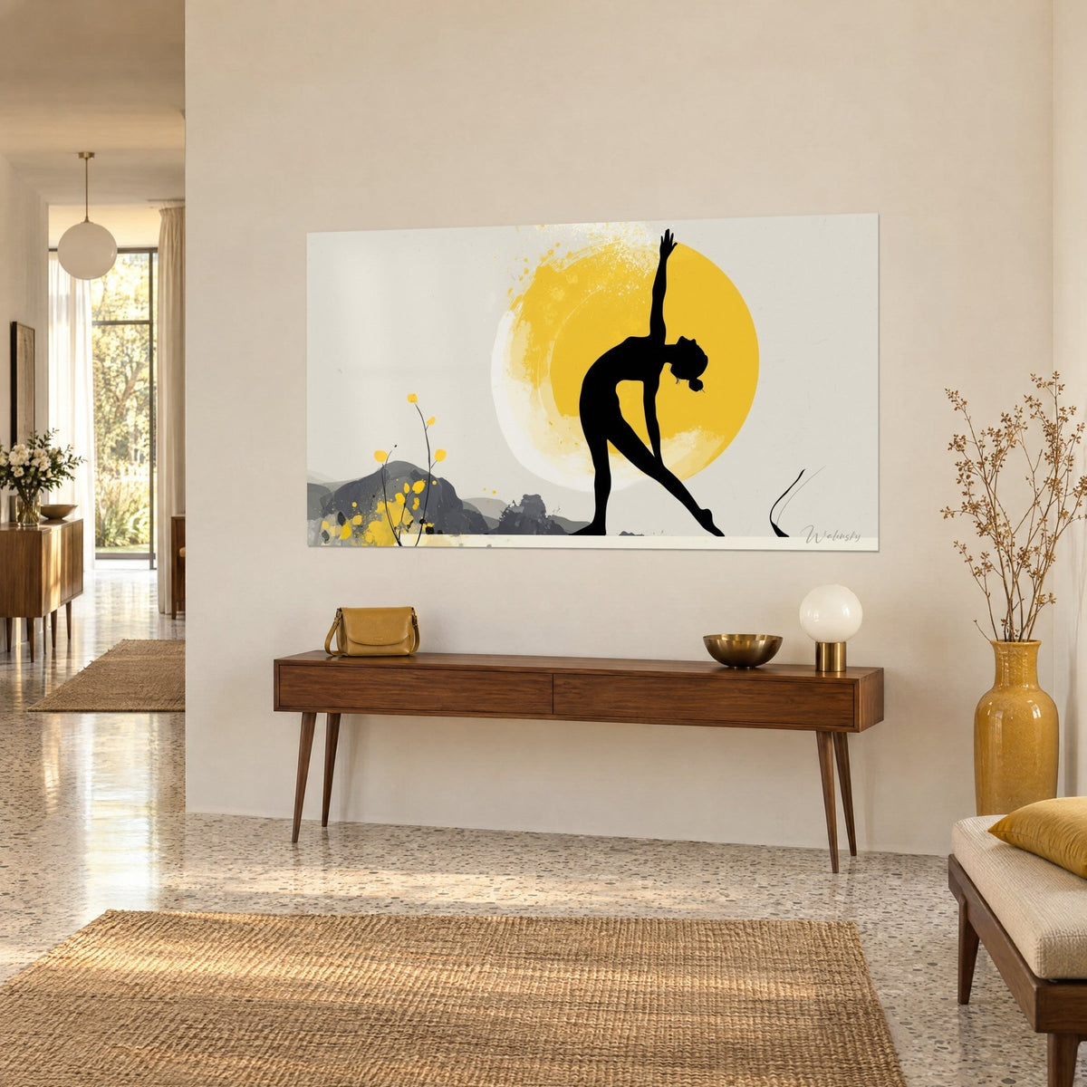 Wall art yogi cut out as a black shadow, arm stretched toward a golden disc, grey hills, on a beige wall above a wooden console