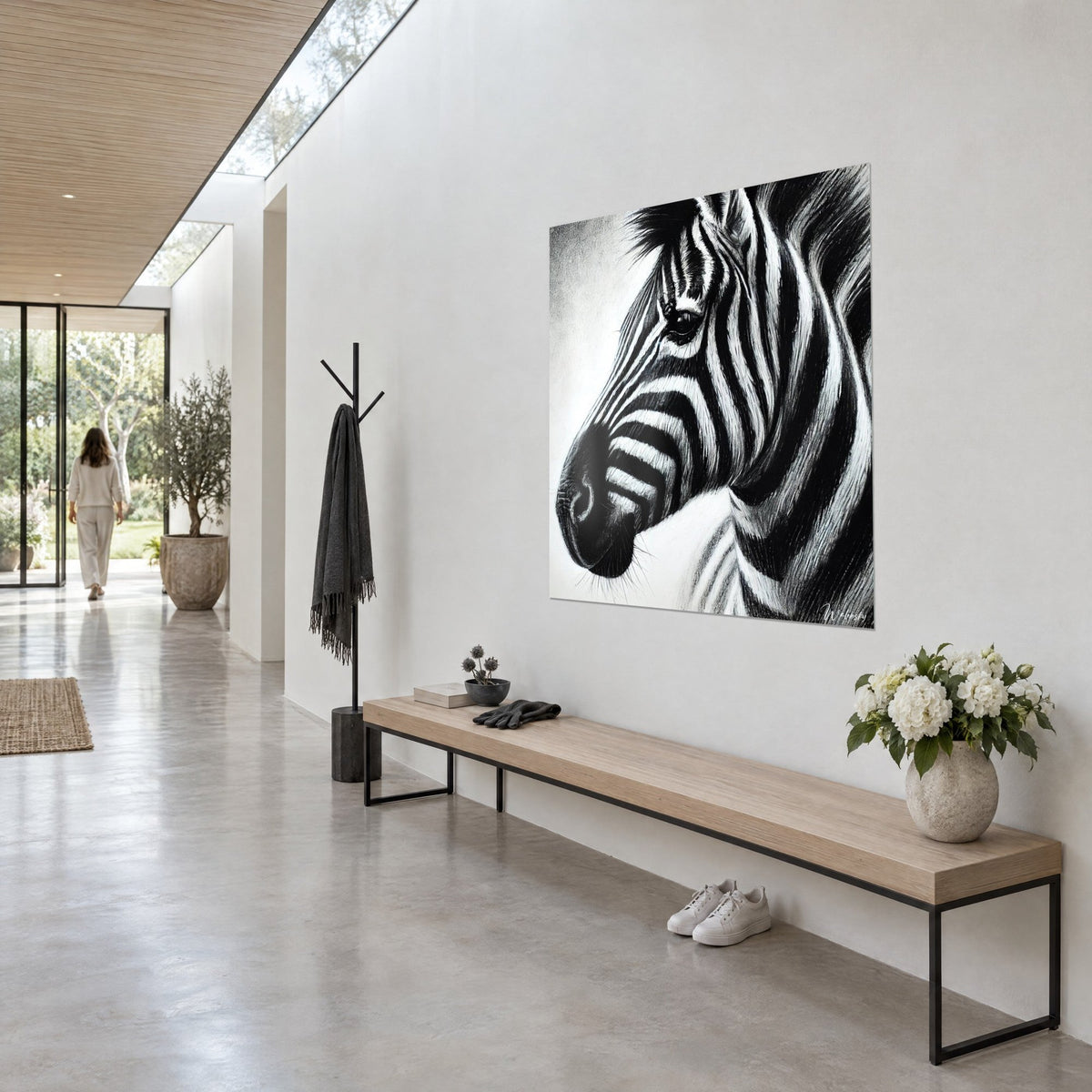Wall art zebra portrait with bold graphic stripes in deep black and chalky white, bristling mane, bright hallway seen three-quarter view