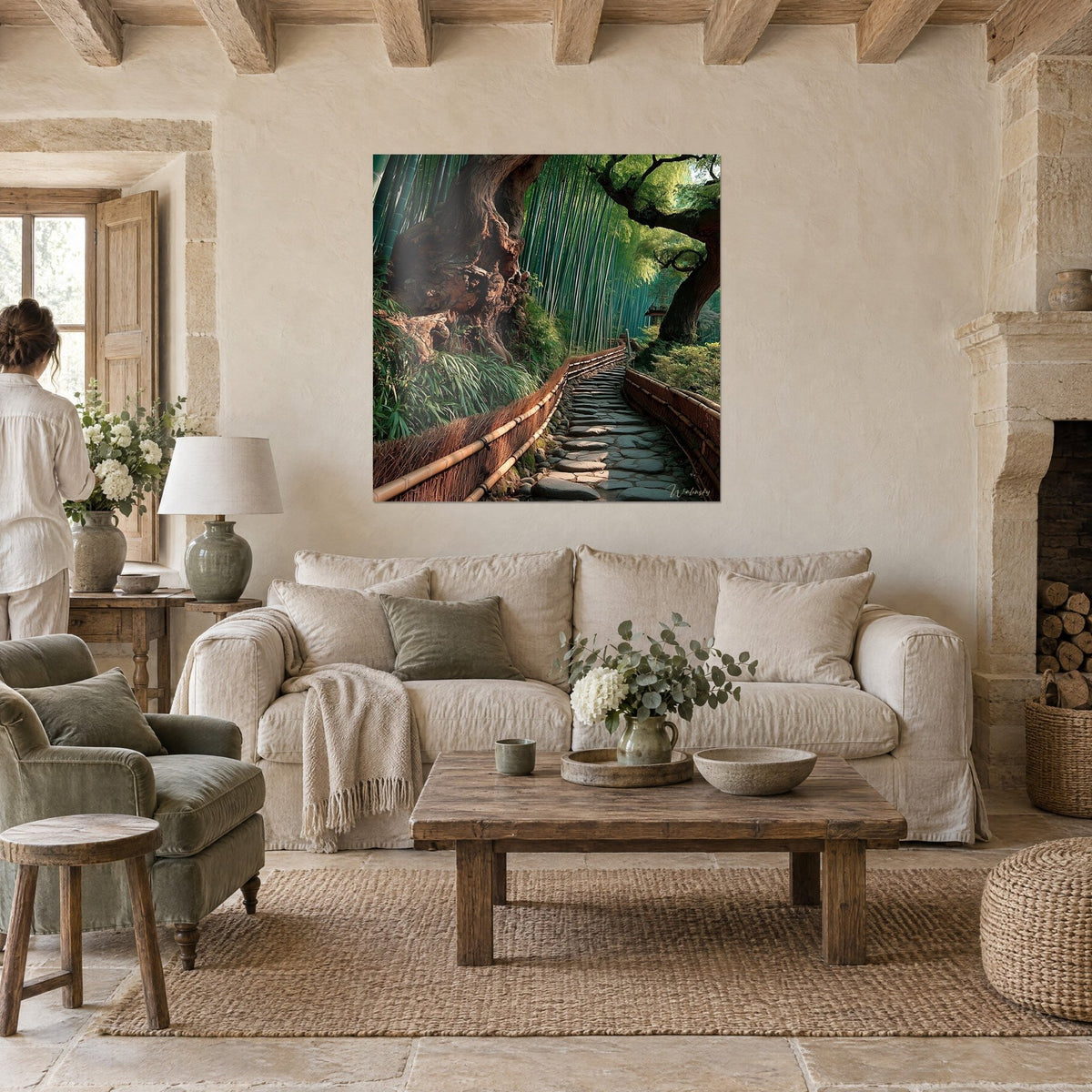Wall art winding stone path between emerald bamboo and an old brown trunk, two people seen from behind, above a sofa in a bright living room