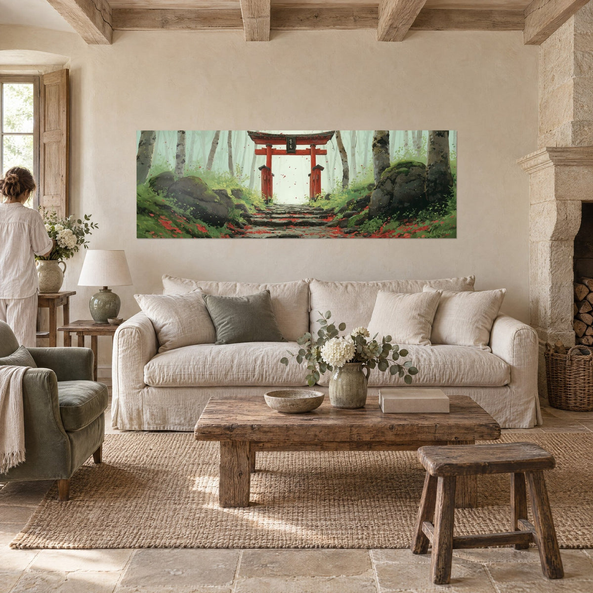 Wall art of a vermilion torii gate in a misty green forest, red petals on the steps, above a sofa in a bright living room