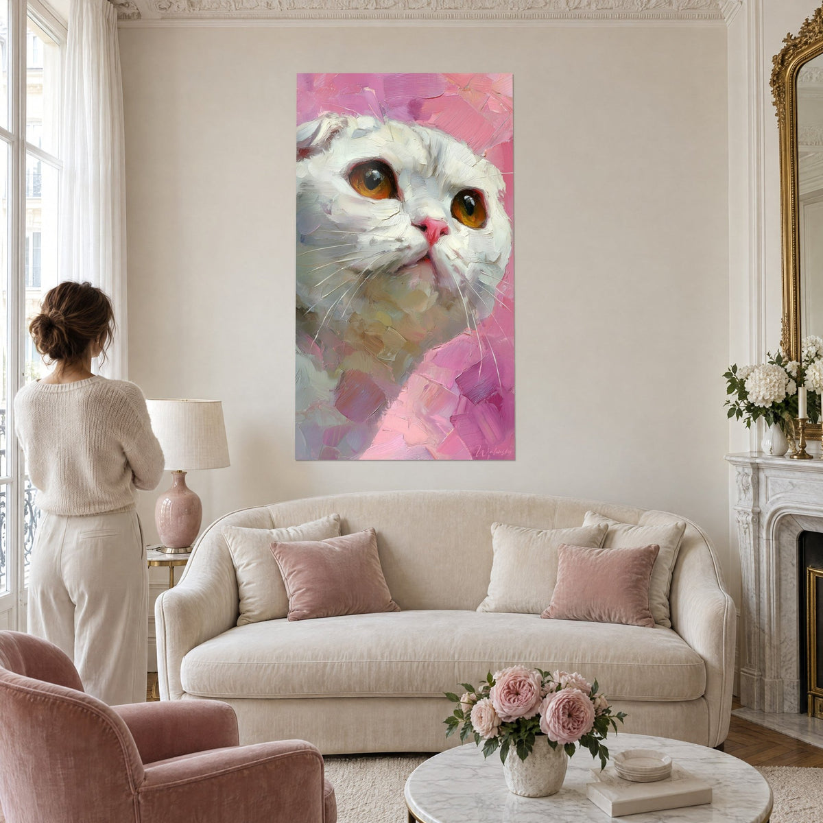 Wall art white kitten with large amber eyes, thick pink textured background, above a sofa in a bright living room