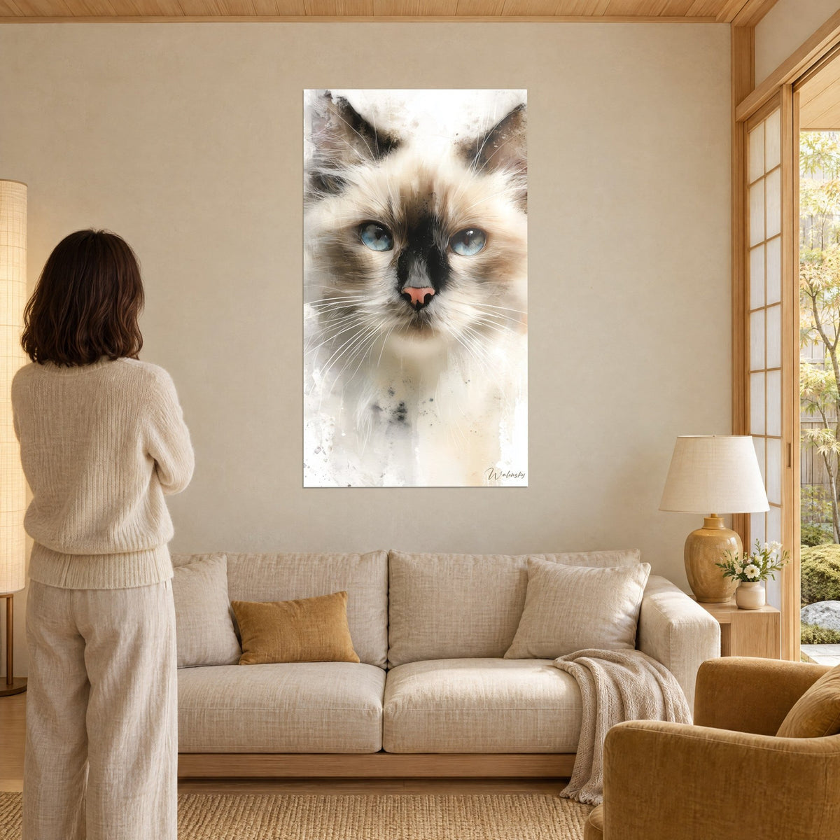 Wall art Birman cat with glacier-blue eyes and brown mask, cream coat, in a japandi living room, above a sofa in a bright lounge
