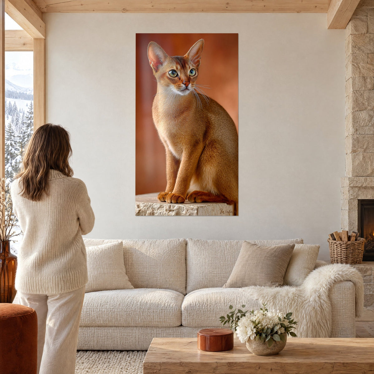 Wall art seated Singapura cat, golden-brown coat and terracotta background, above a sofa in a bright living room