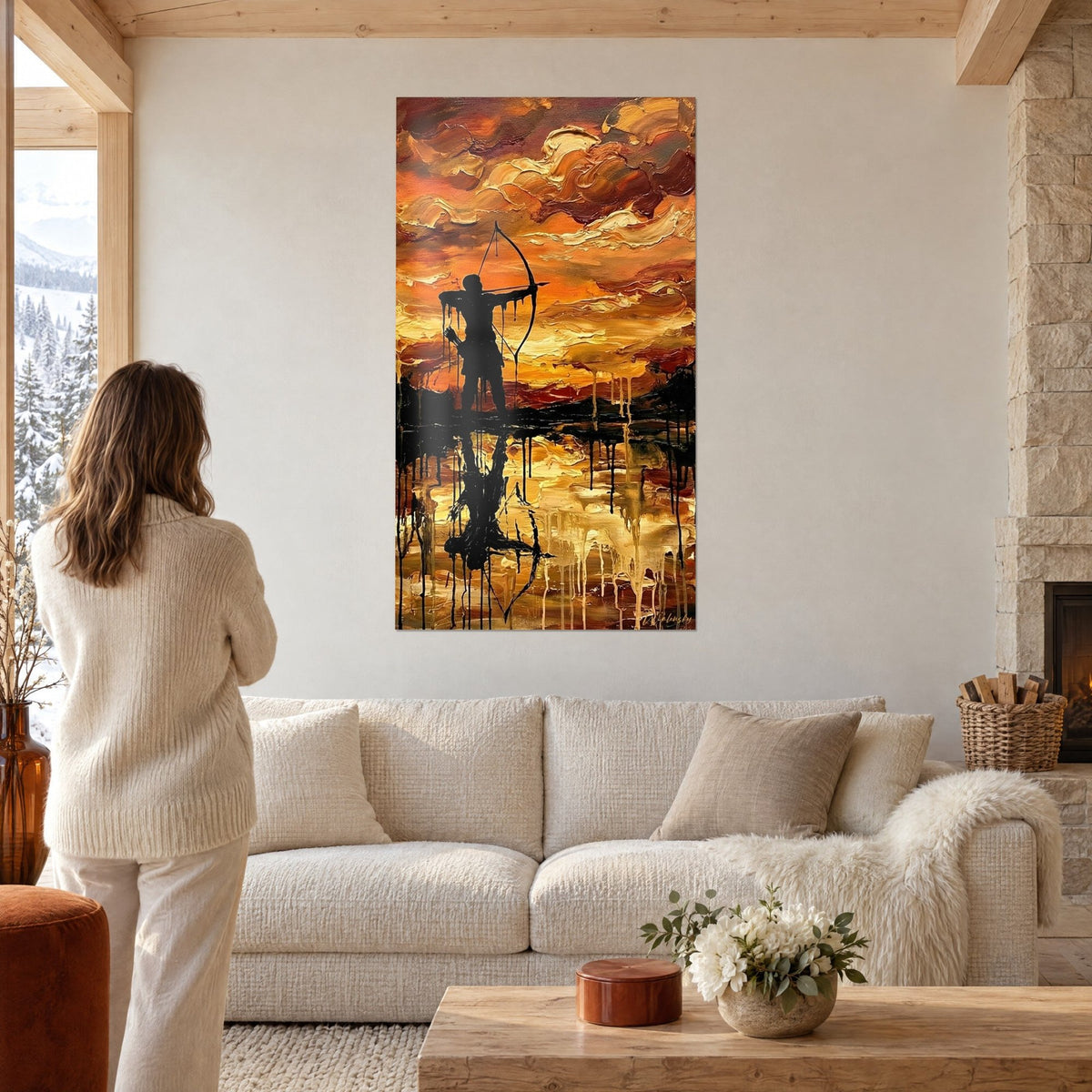 Tableau archer en silhouette noire bandant son arc sur un ciel orange et ocre, au-dessus d'un canapé dans un salon lumineux
