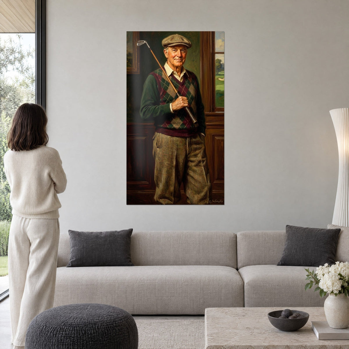 Wall art of an old golfer in a flat cap, waistcoat with burgundy and green diamonds, club resting on his shoulder, above a sofa in a bright living room