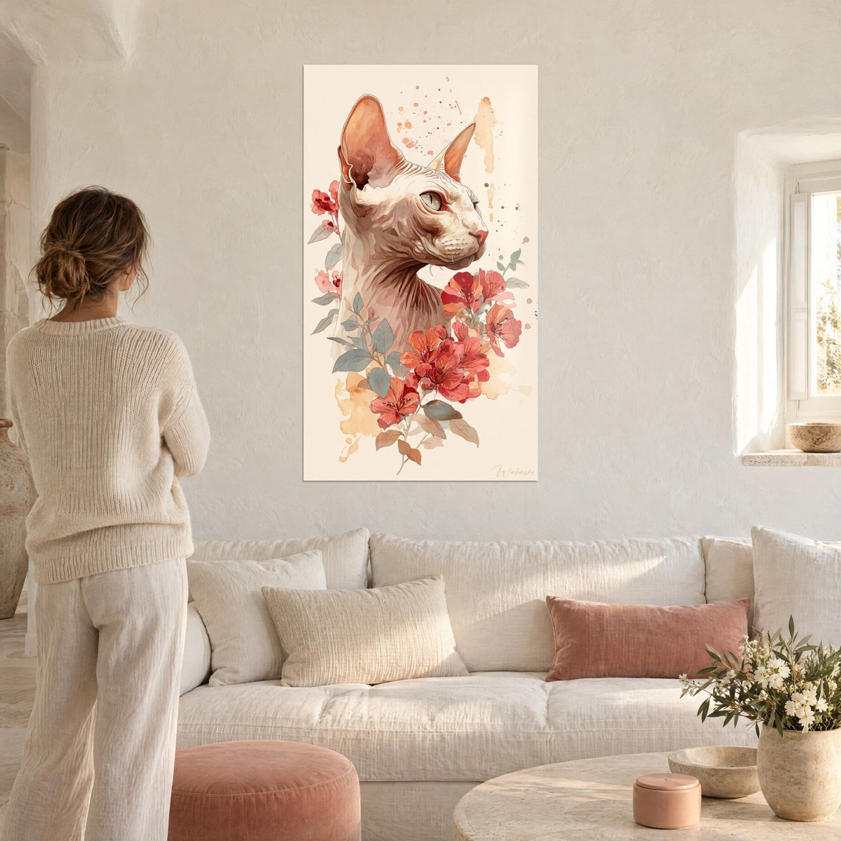 Wall art hairless Sphynx cat with large pink ears and coral flowers on a cream background, above a sofa in a bright living room