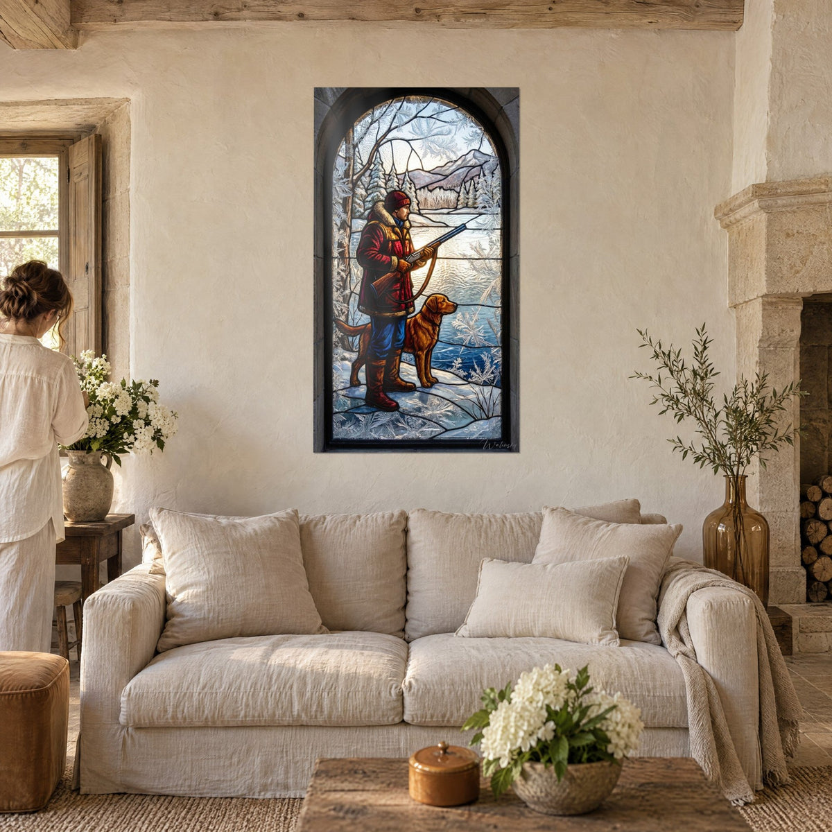 Wall art hunter in red parka with his ginger dog on a frozen lake, frosted blue stained glass, above a sofa in a bright living room
