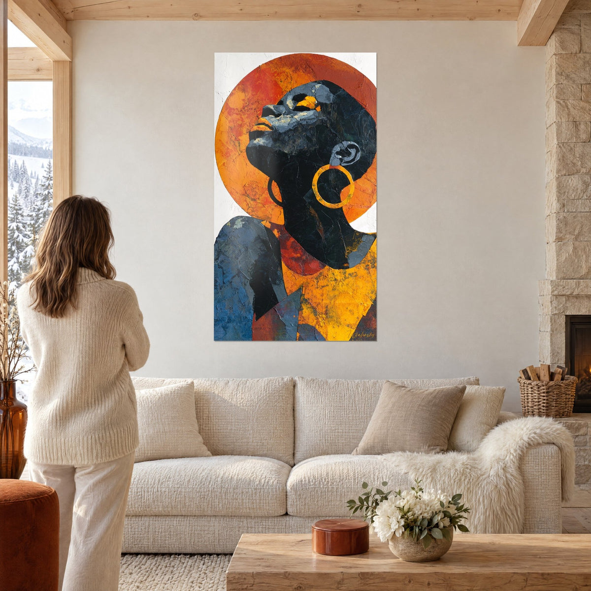 Wall art African face turned toward the sky, orange halo and golden earring, above a sofa in a bright living room
