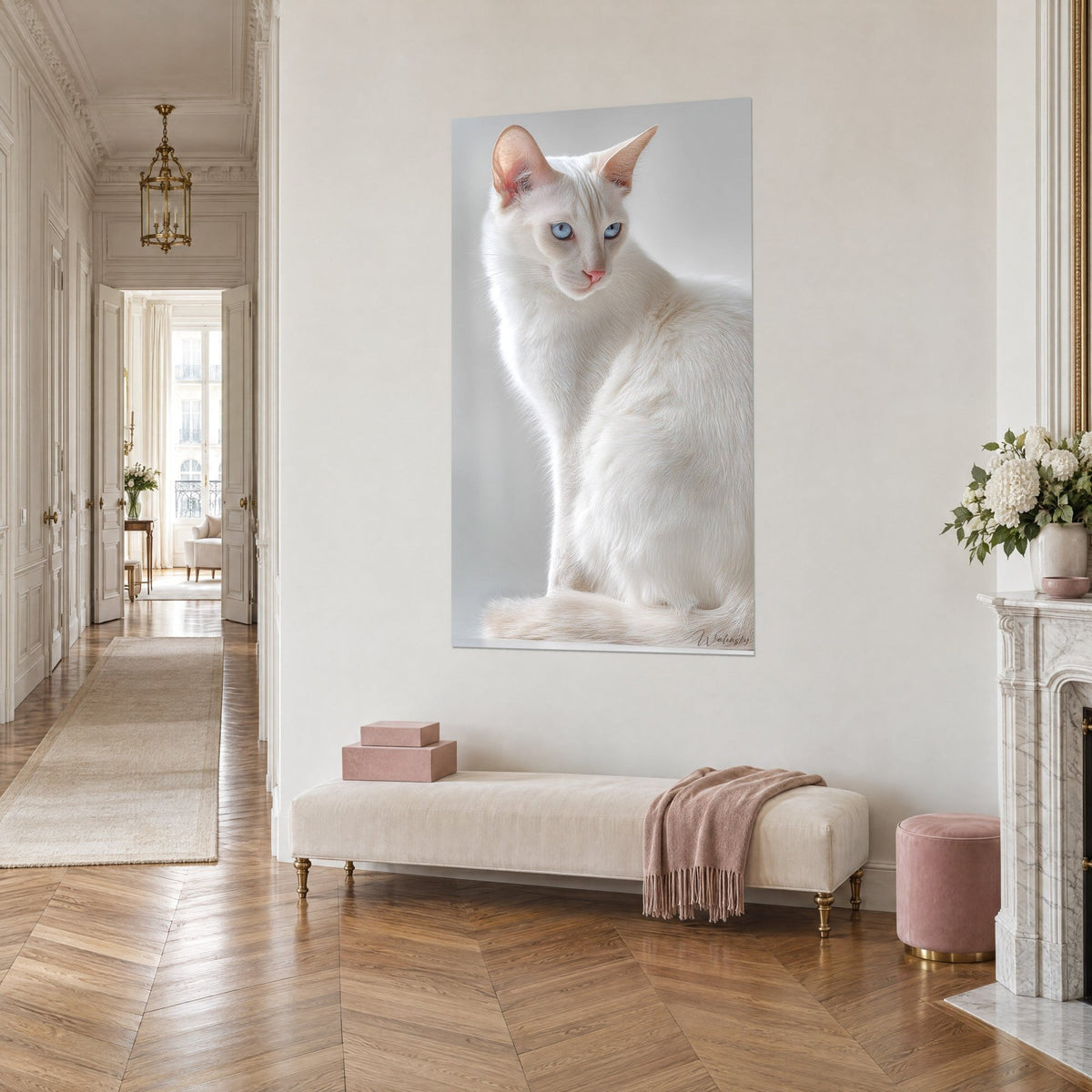 Wall art ivory seated cat with pink muzzle and icy blue sideways gaze, on a beige wall, Haussmann-style hallway