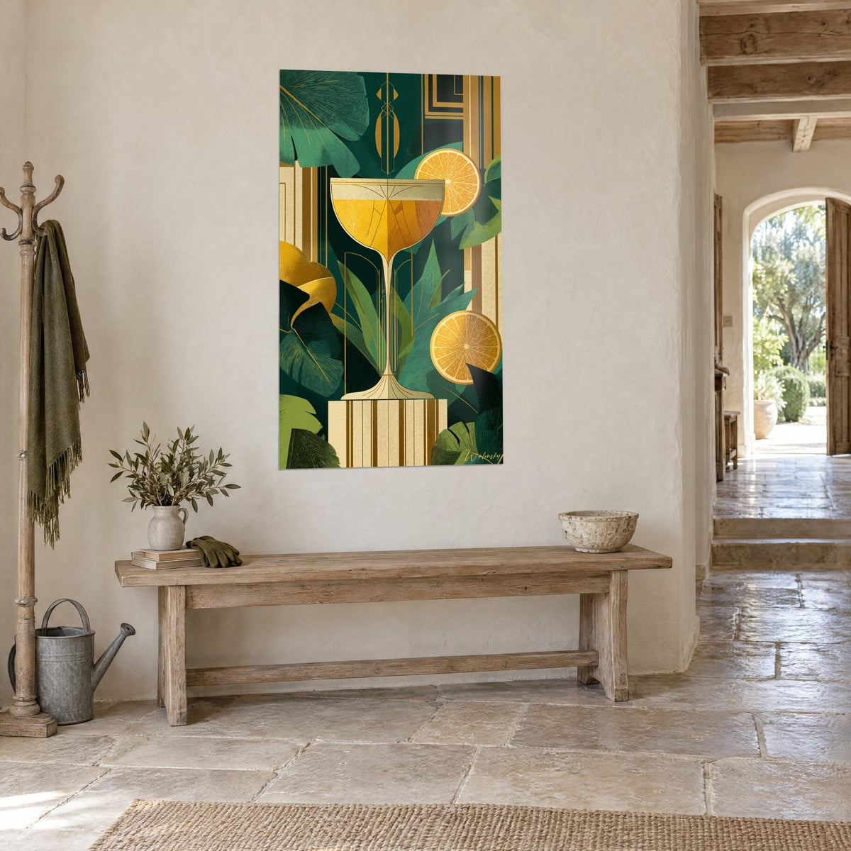 Wall art of gold and cream geometric patterns on a fir green background, hung in a stone-walled hallway