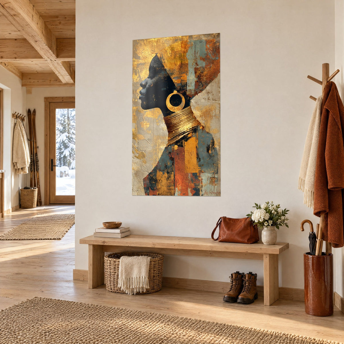 Tableau silhouette sombre au collier d'or empilé, fond gris-bleu et orange brûlé, accroché dans une entrée en bois de chalet